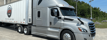 Dry van truck parked at loading dock