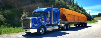 Flatbed semi on dirt road