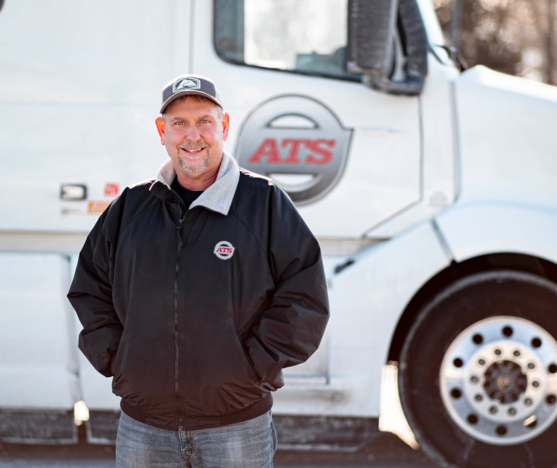 ATS driver with a white semi truck